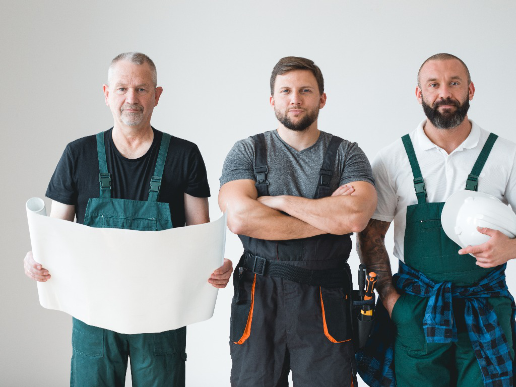 Group of Contractors. One holding some plans