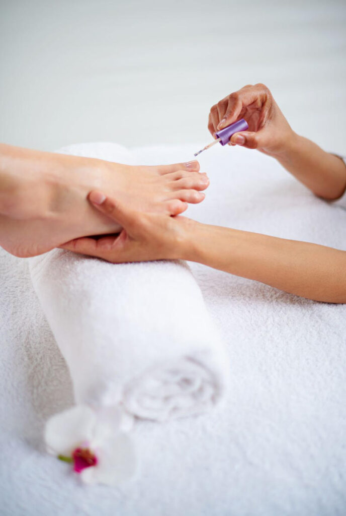 Woman receiving a pedicure in a spa