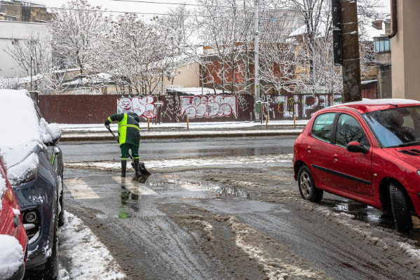 Snow removal worker cleaning snowy road